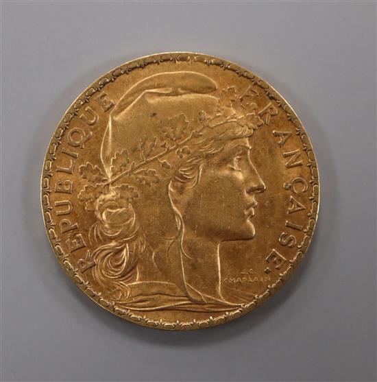 A French 1906 gold 20 franc coin.